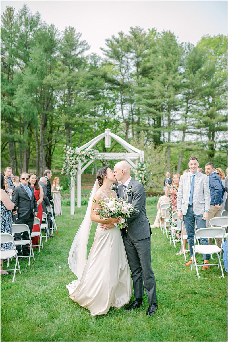 Couple share a kiss for New England Wedding Photographer