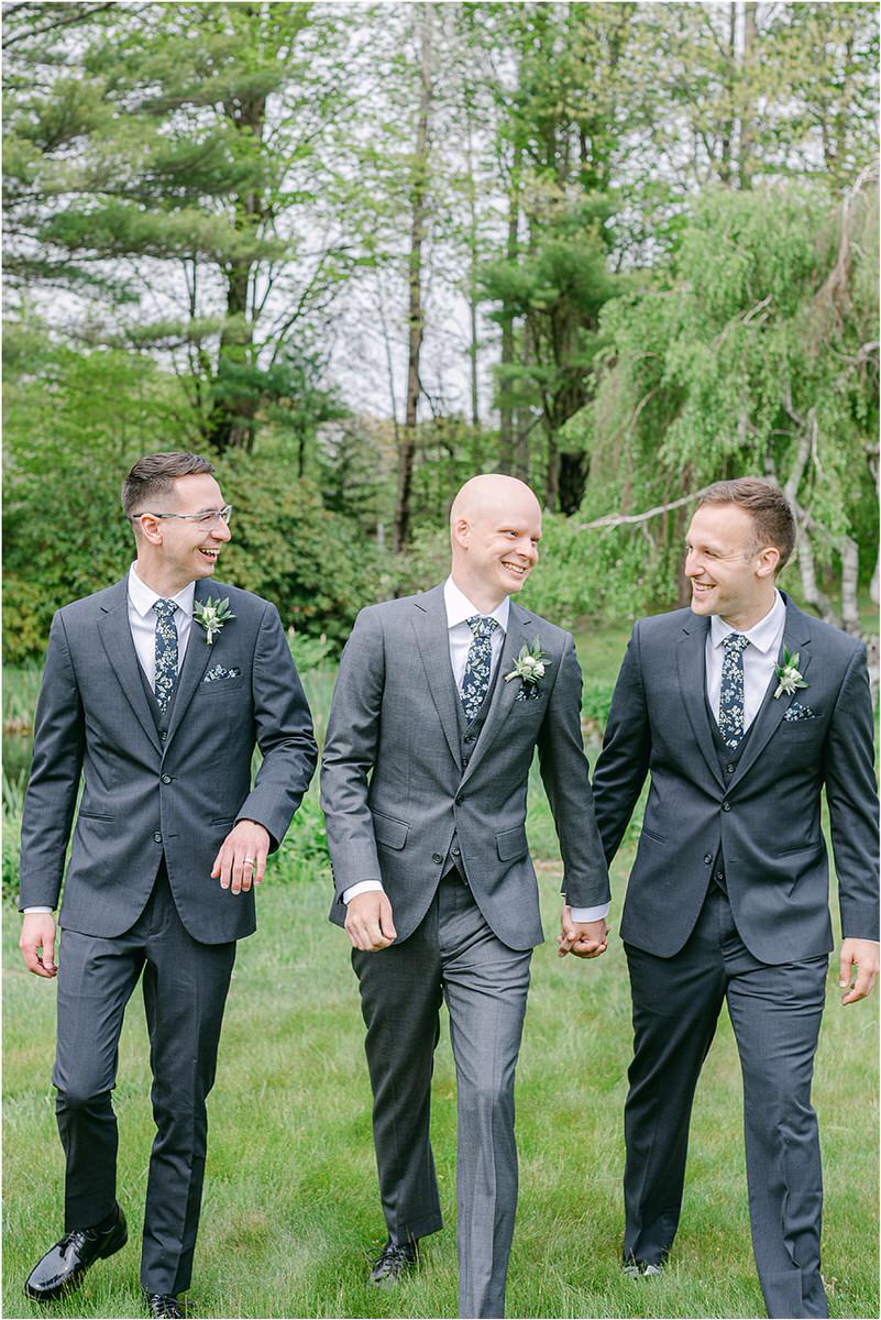 Groom smiles with family and friends for New England Wedding Photographer