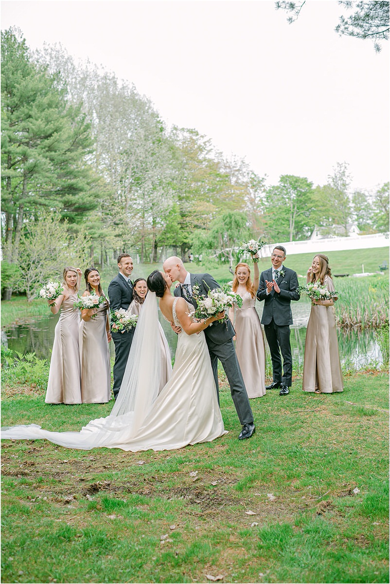 Bride and groom share a kiss for New England Wedding Photographer