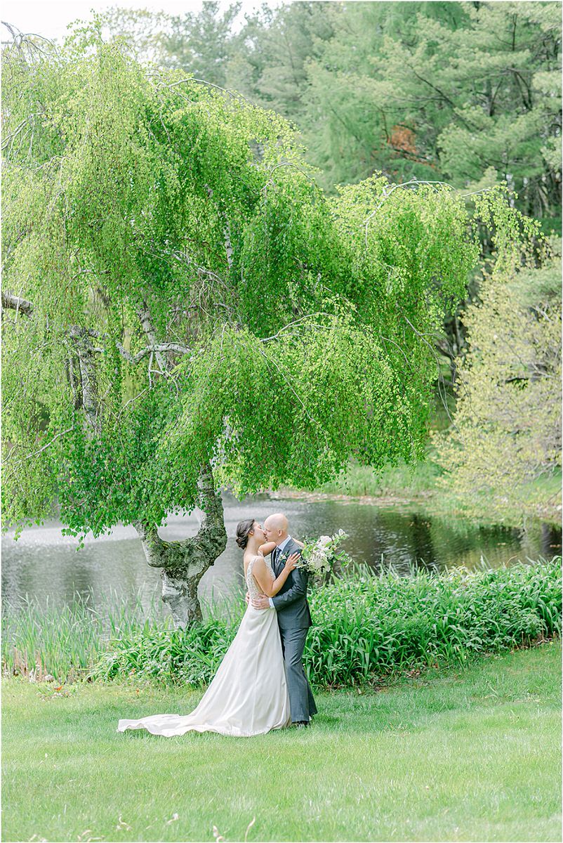 Bride and groom cuddle in close together for New England Wedding Photographer
