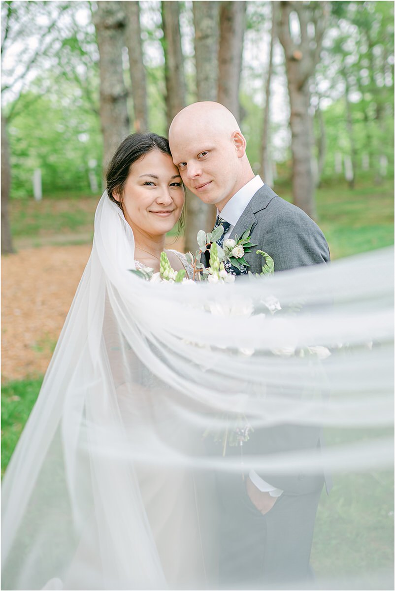 Bride and groom hold each other close for New England Wedding Photographer
