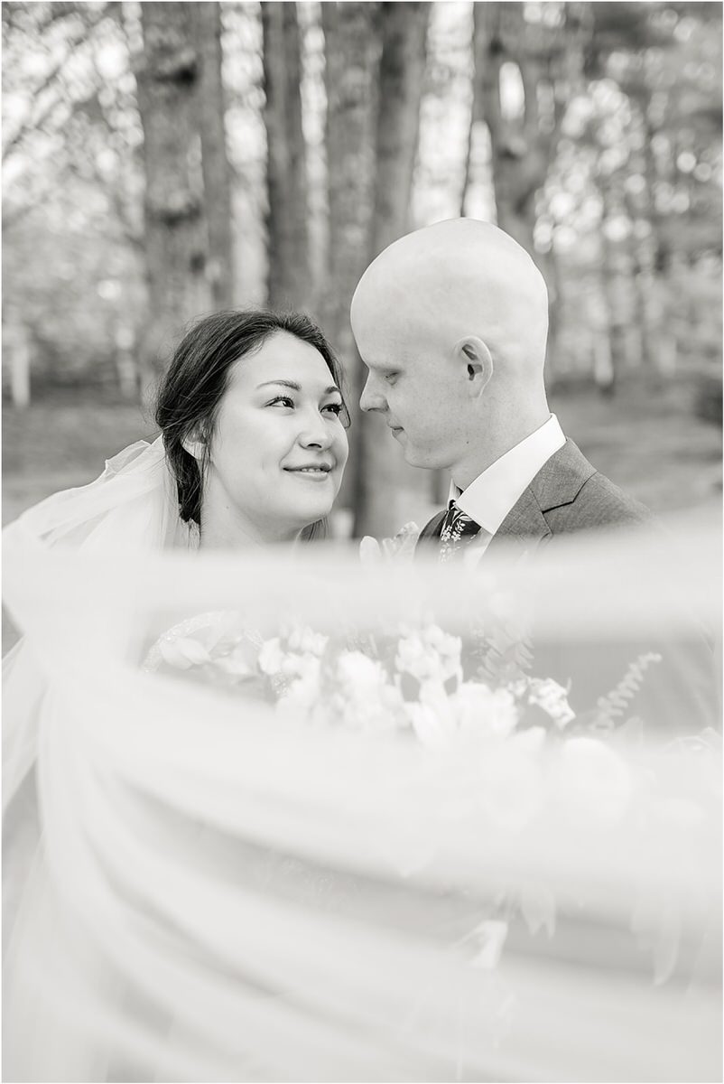 Couple smile at each other for New England Wedding Photographer