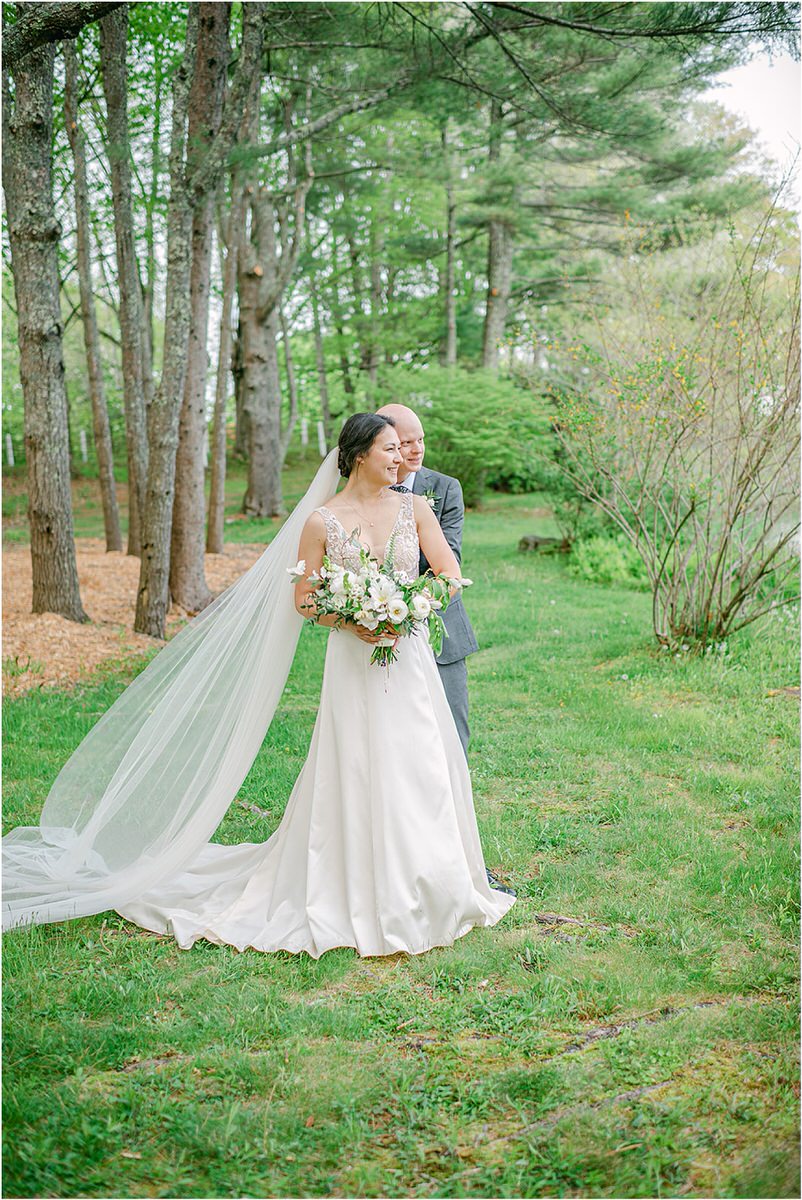 Bride and groom stand close together for New England Wedding Photographer