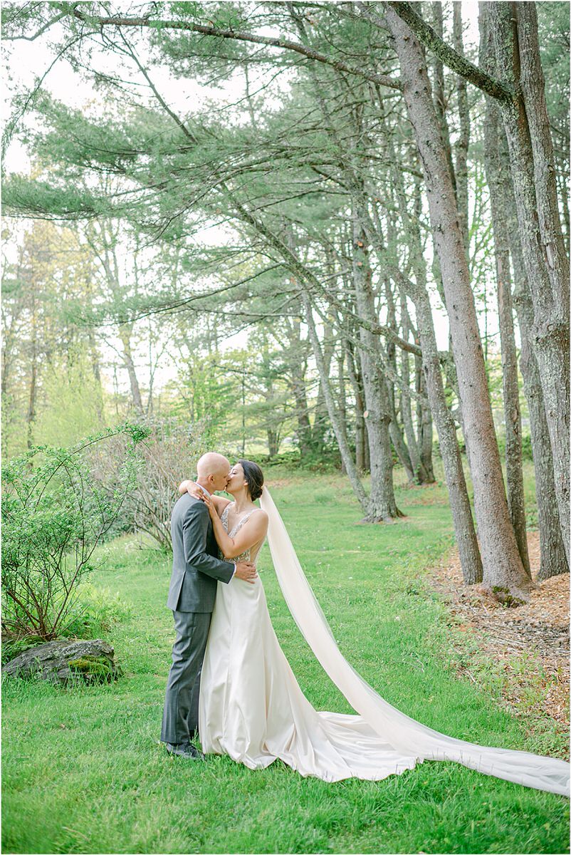 Man and woman share a kiss for New England Wedding Photographer