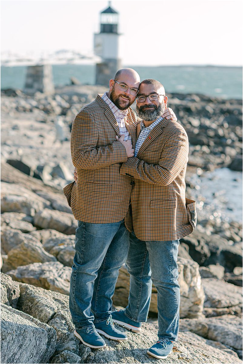 Couple hold each other before their Maine fall elopement