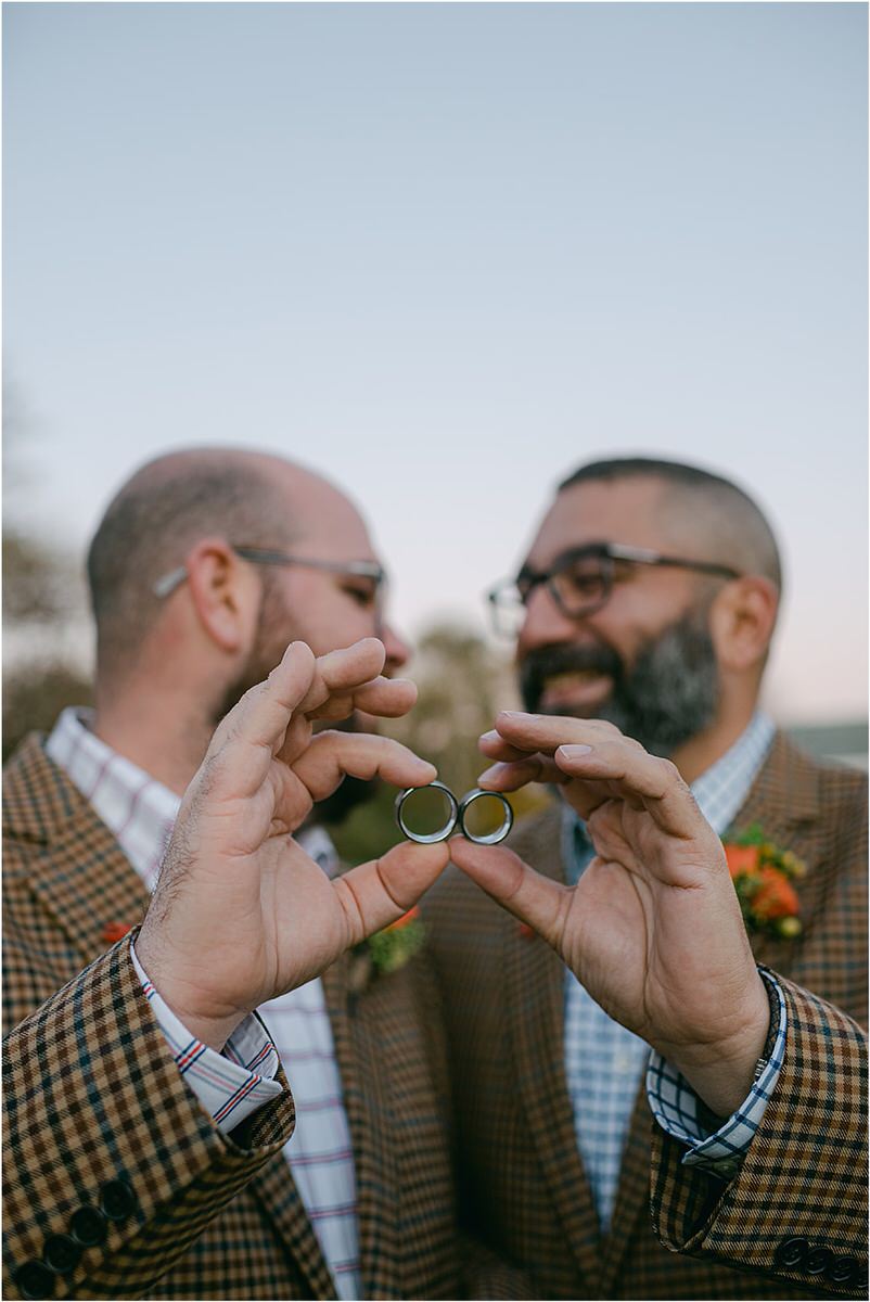 Happy couple show off their rings before their Maine fall elopement