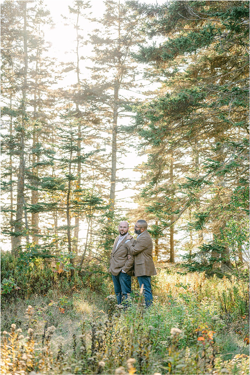 Couple stand together before their Maine fall elopement