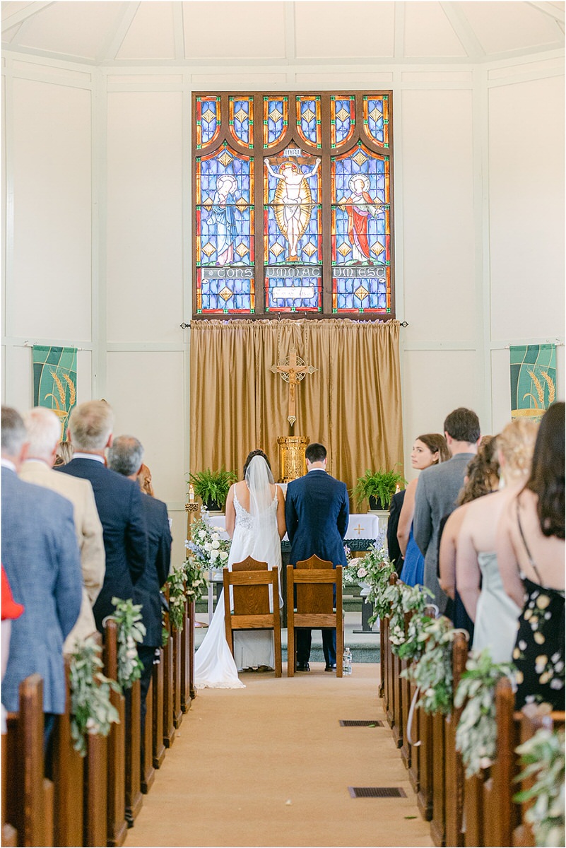 Bride and groom stand together at chapel before wedding at Portland's Ocean Gateway