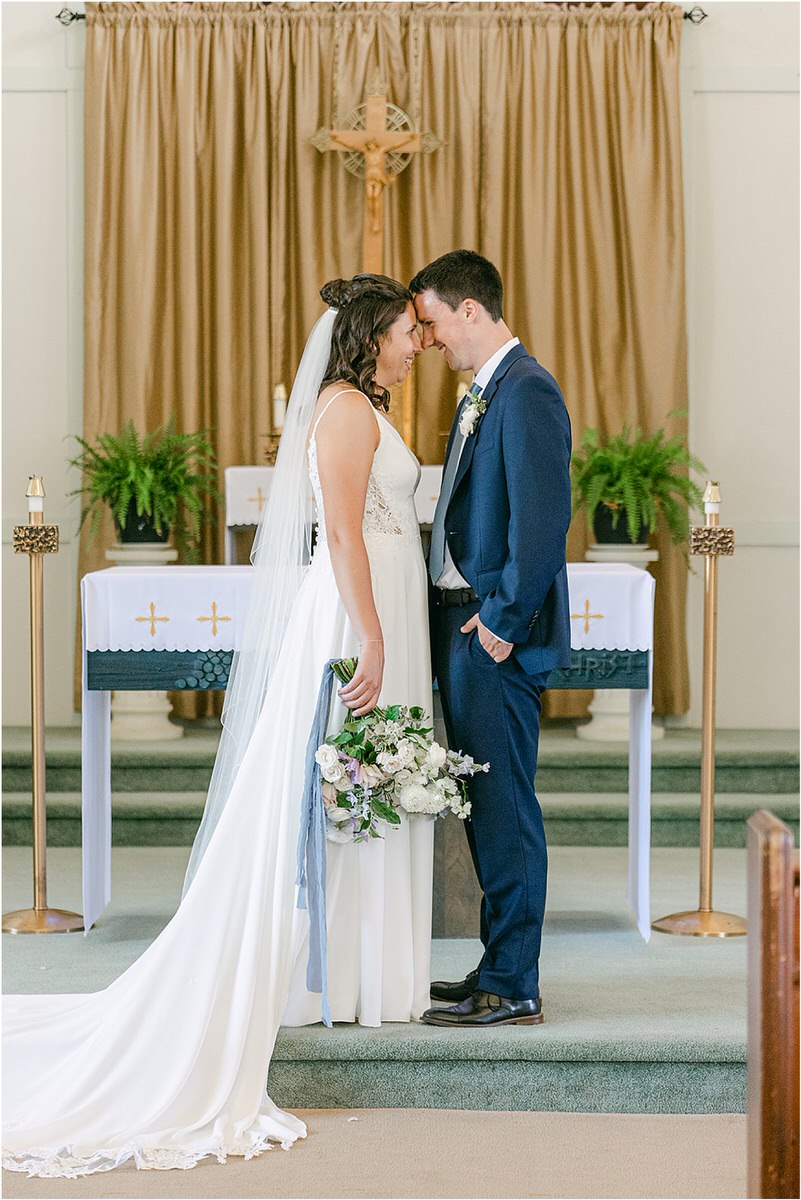 Couple stand close together for wedding at Portland's Ocean Gateway