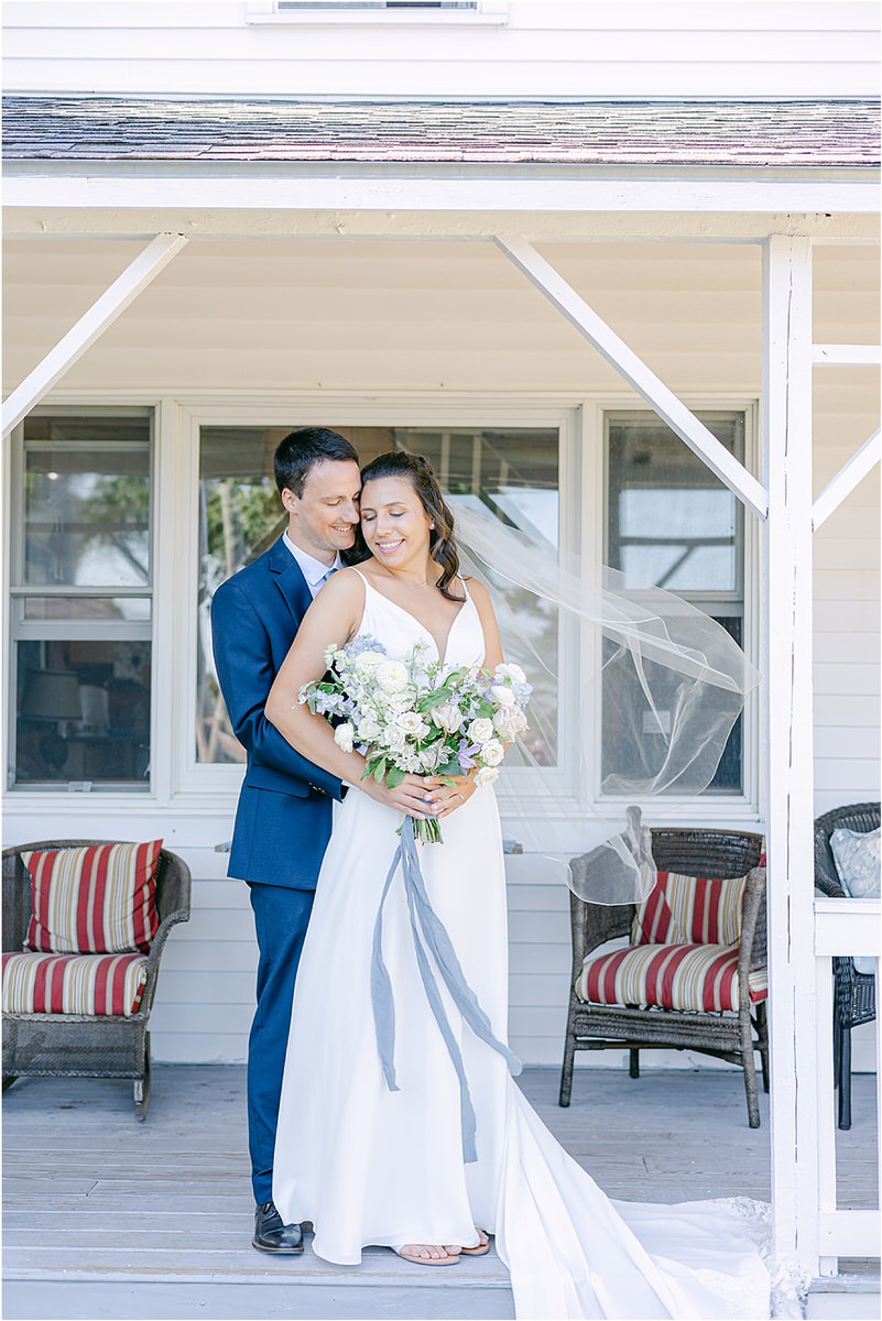 Bride and groom share a hug before celebration at Portland's Ocean Gateway