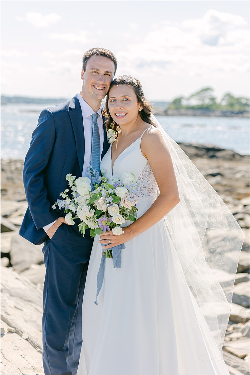 Bride and groom cuddle in close together at Rachel Campbell Photography