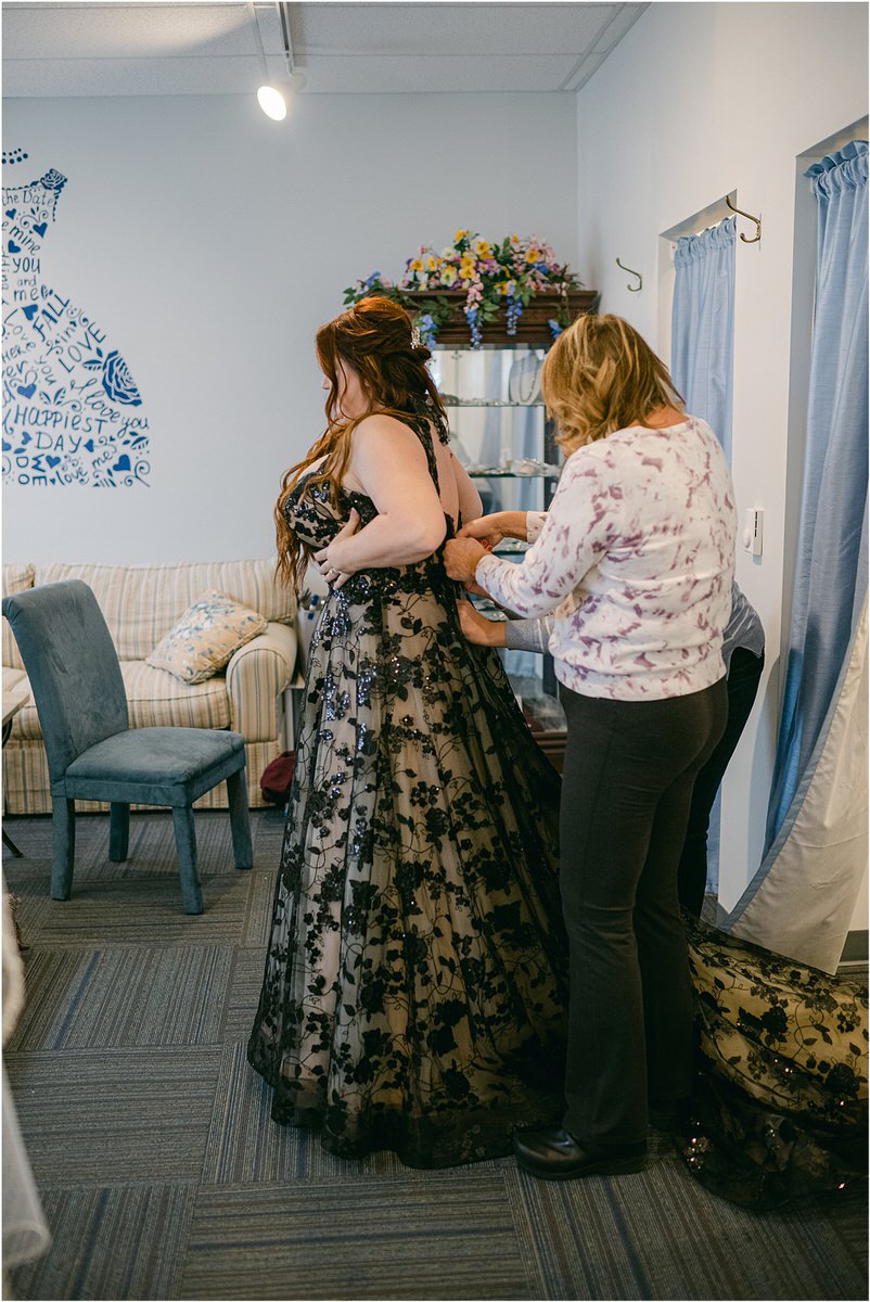 Bride gets into bridal gown at The Strand Theatre