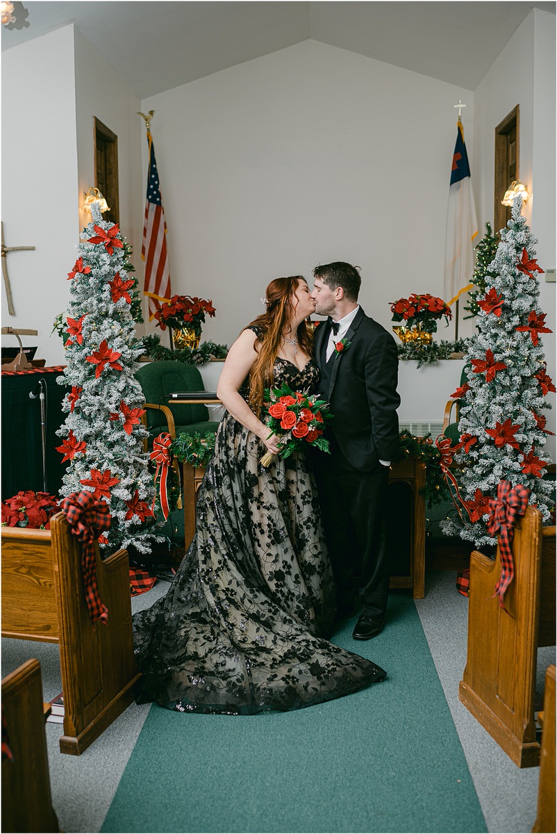 Bride and groom share their first kiss at The Strand Theatre
