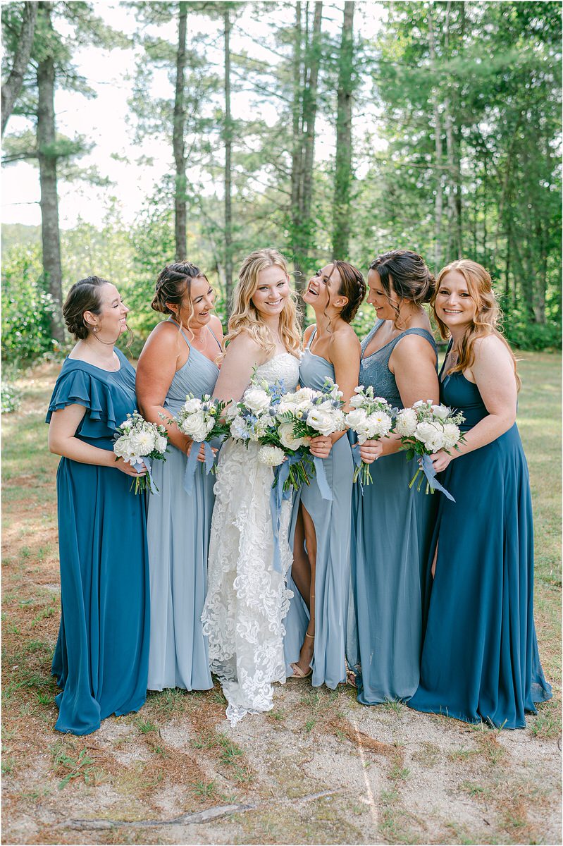 Bridesmaids stands with bridesmaids at Bear Mountain Inn