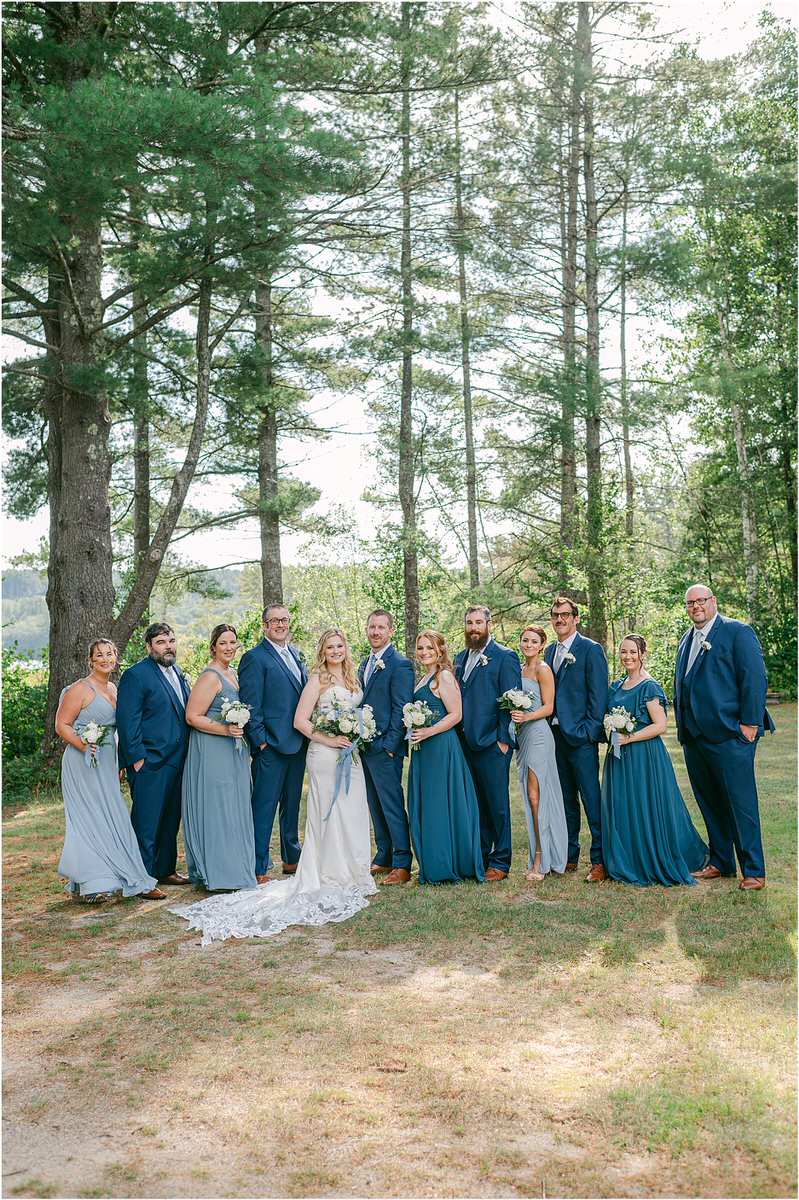 Family and friends laugh and smile with bridesmaids at Bear Mountain Inn