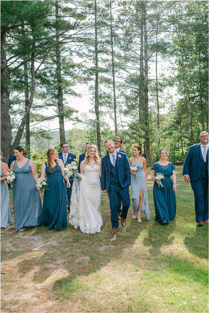 Bride and groom walk together at Bear Mountain Inn