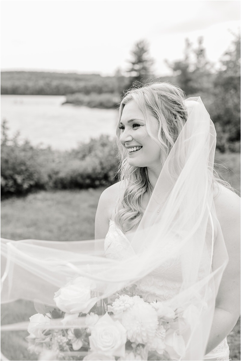 Bride smile wearing her veil at Bear Mountain Inn