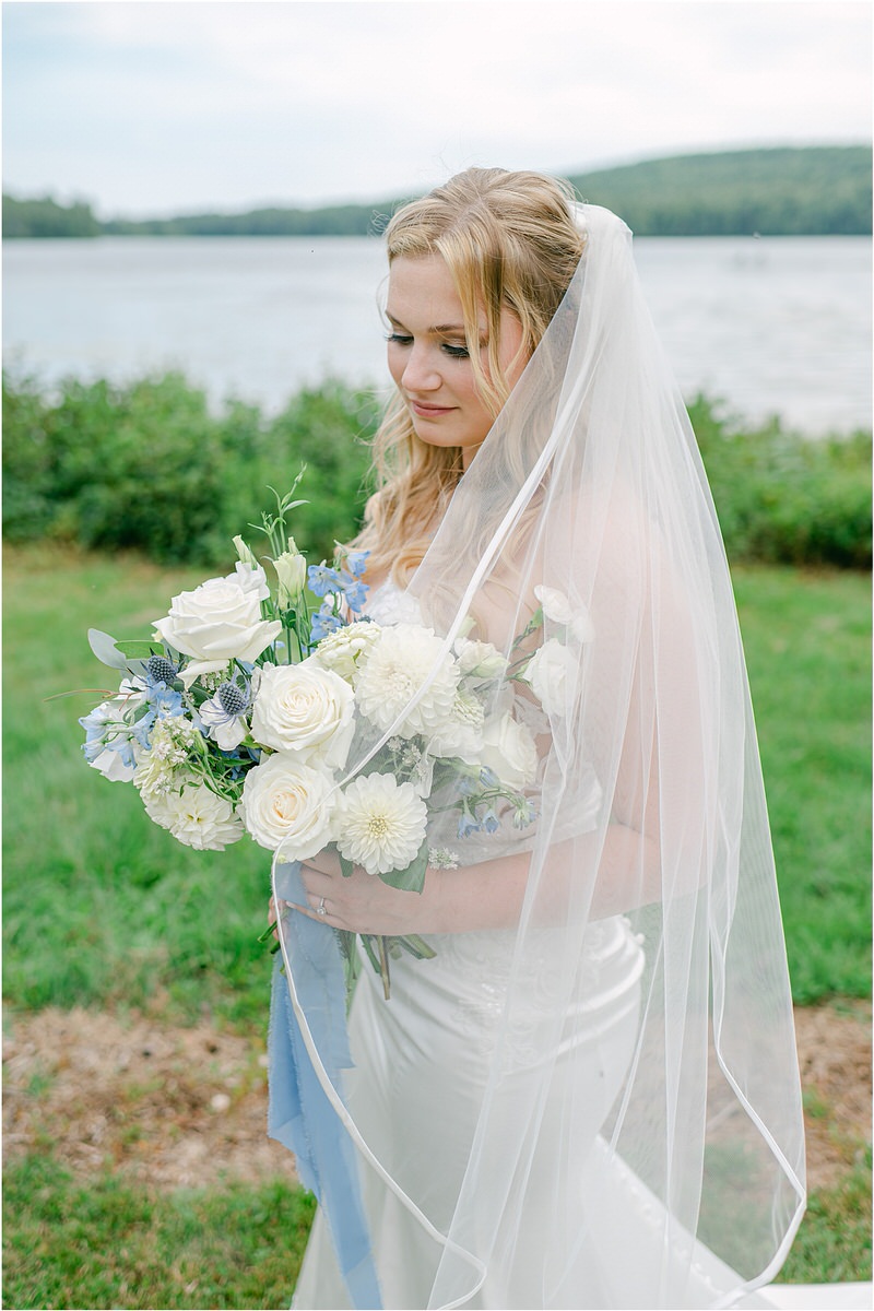 Bride holds her beautiful custom bouquet at Bear Mountain Inn