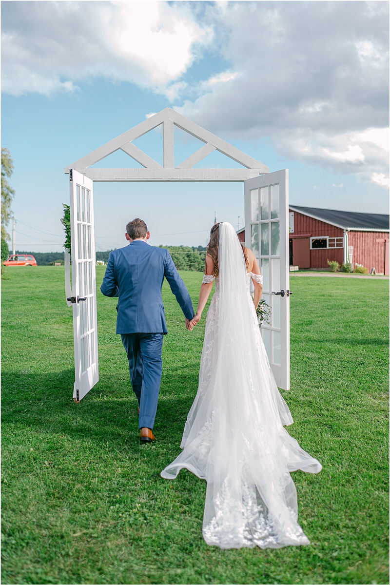 Couple hold hands together at Harmony Hill Farm