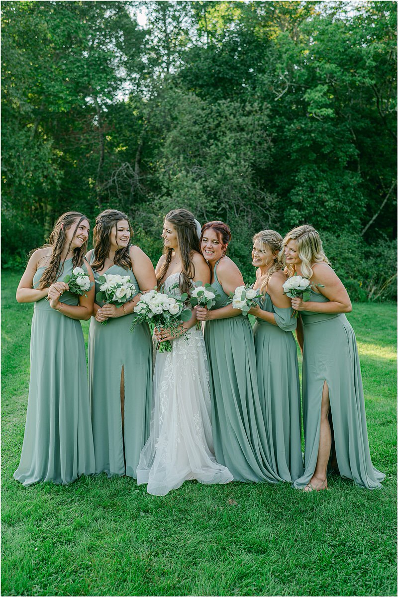 Bride stands among family and friends at Harmony Hill Farm