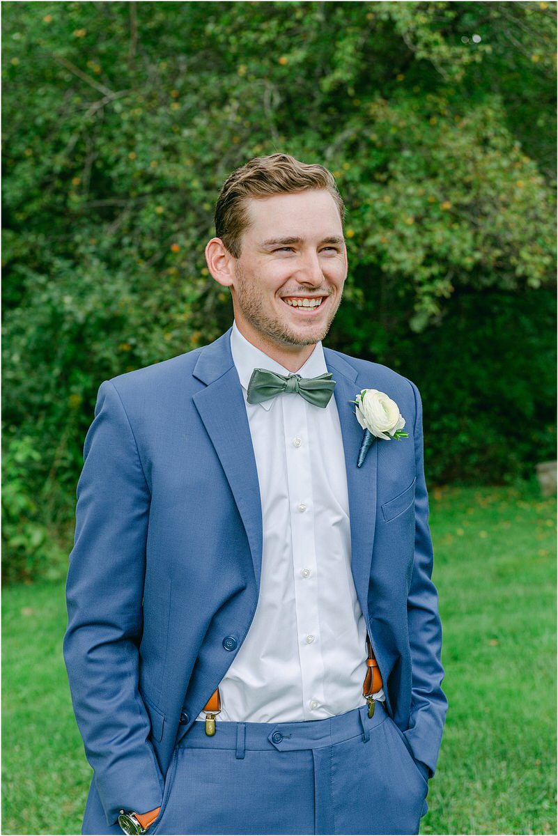 Groom shares a smile at Harmony Hill Farm