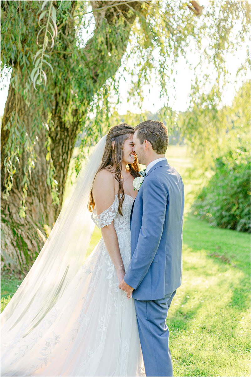 Bride and groom share a kiss at Harmony Hill Farm