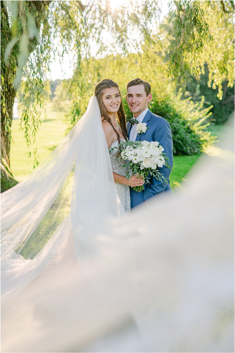 Bride and groom share a smile together for Rachel Campbell Photography