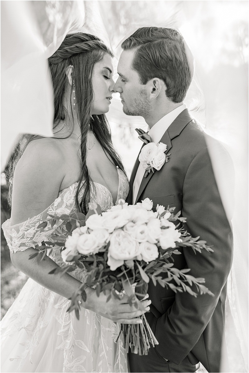 Bride and groom cuddle in close for Rachel Campbell Photography