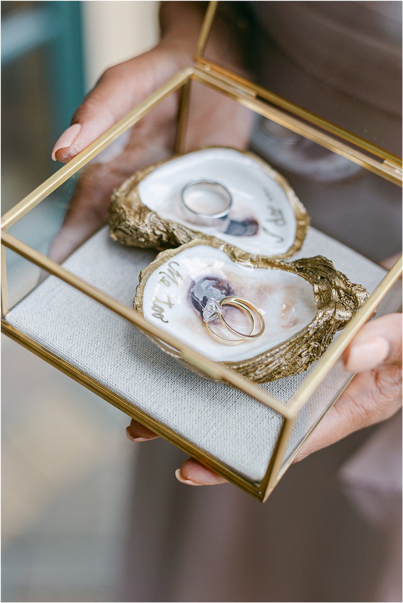 Stunning wedding rings in oyster shell at The Red Barn at Outlook Farm