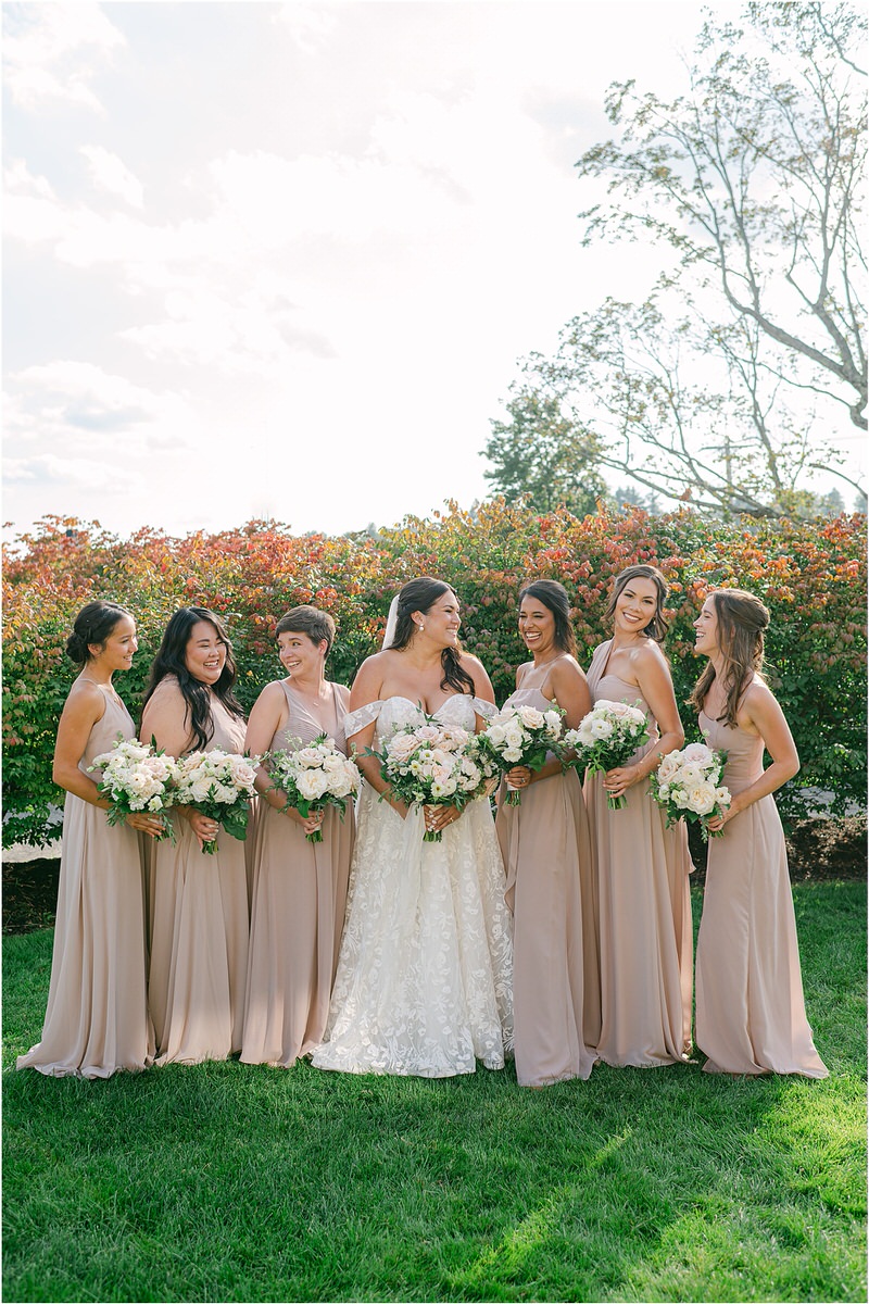 Bride smiles at her family and friends for Rachel Campbell Photography