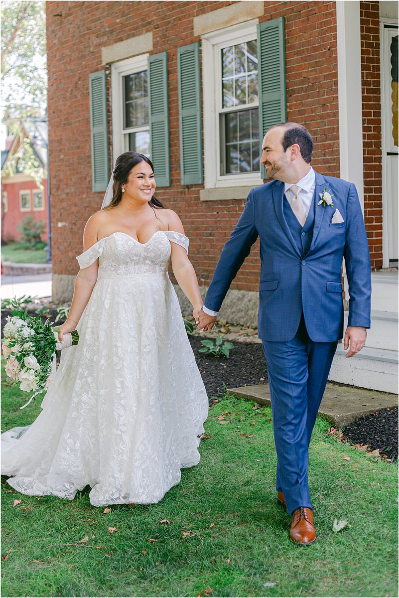 Couple walk together and hold their hands for Rachel Campbell Photography