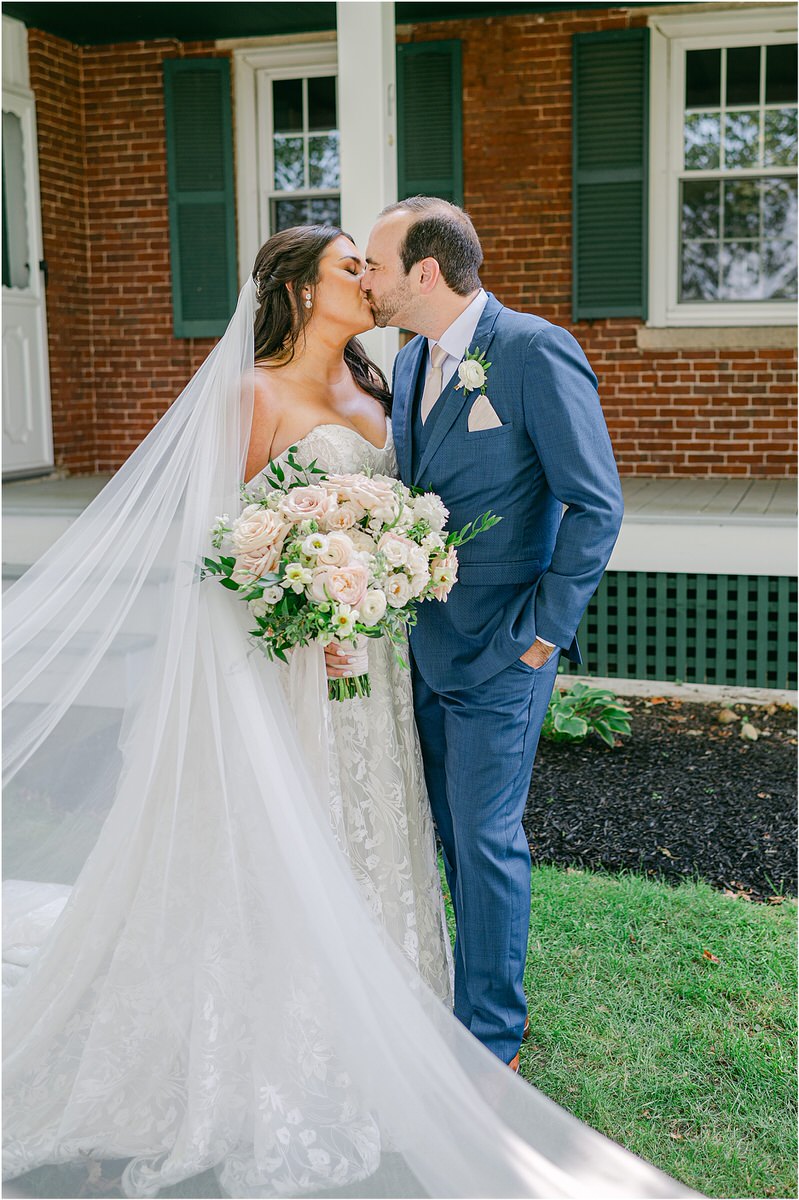 Husband and wife share a kiss for Rachel Campbell Photography