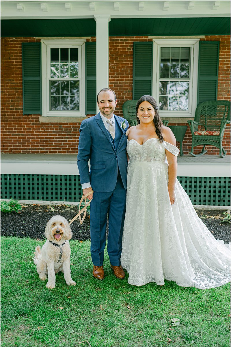 Couple stand with their dog for Rachel Campbell Photography