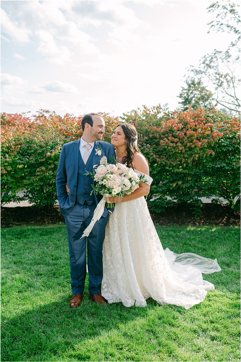 Bride and groom smile at one another for Rachel Campbell Photography