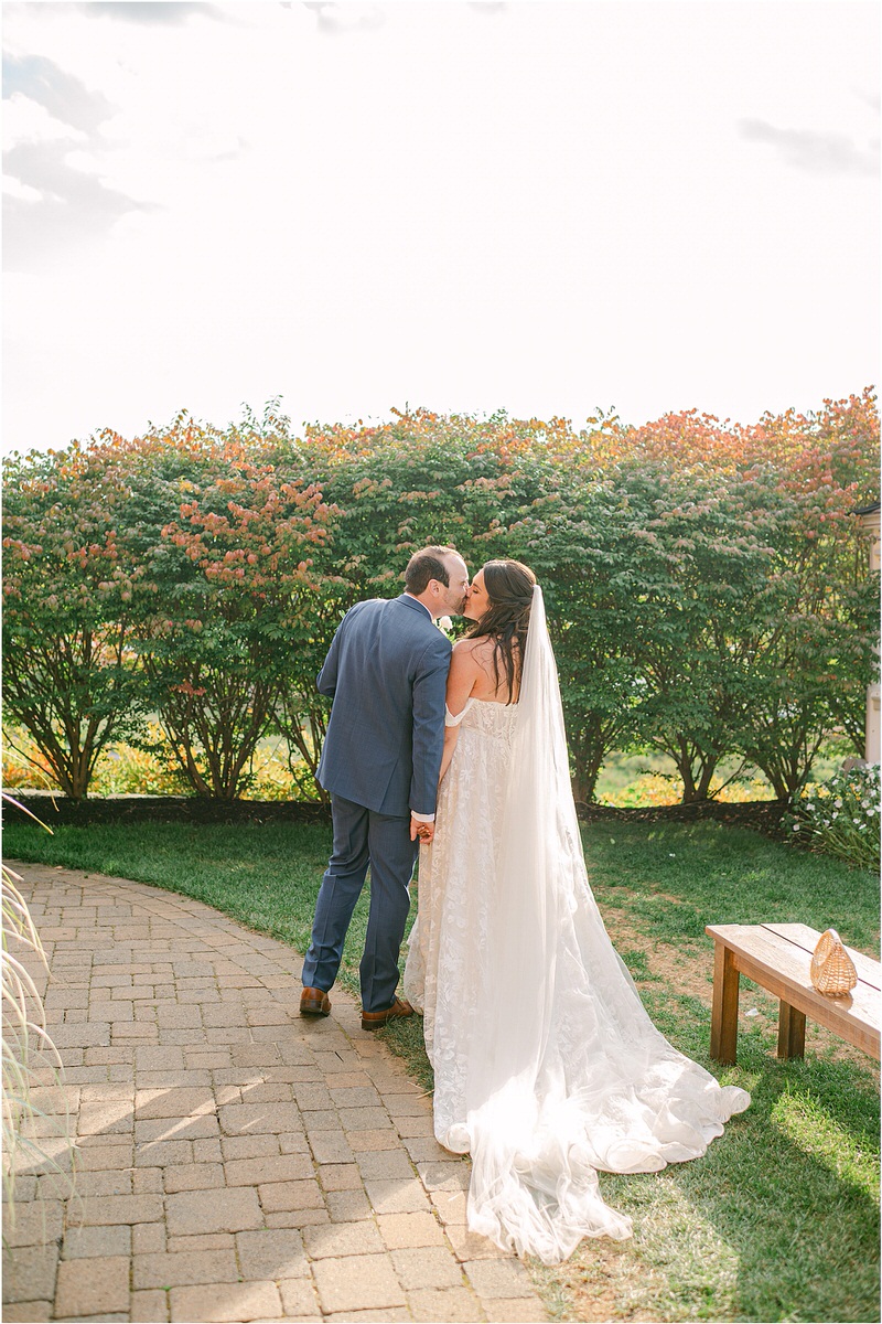 Husband and wife share a kiss for Rachel Campbell Photography