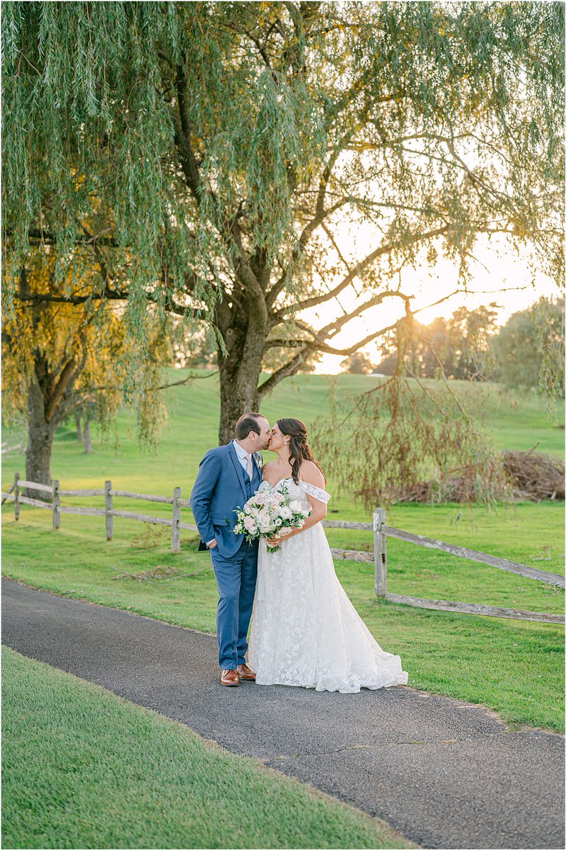 Bride and groom share a kiss for Rachel Campbell Photography
