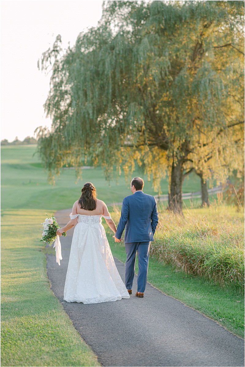 Husband and wife walk hand in hand together for Rachel Campbell Photography